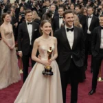 Young actress holding her Oscar nomination with a glamorous red carpet and flashing camera shutters at the Oscars