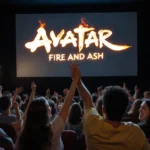 Two people high‑fiving with popcorn and candy in the concession stand and a movie theater screen showing Avatar: Fire and Ash