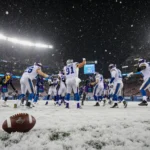 Vikings players celebrating victory with white jerseys and scarves on snowy Ford Field and abandoned football