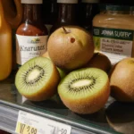 Glass counter displays bruised kiwis with natural and organic claims and hidden sugars behind the healthy facade