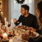 Three friends laughing around a candlelit holiday dinner table with soft golden light and steaming dishes.
