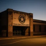 Lake Worth ISD school building standing silent with fading colors and a flickering streetlight.