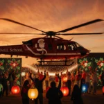 Santa helicopter touching down with holiday lights and cheering children near Hurst‑Euless‑Bedford school in orange dusk