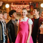 The six Stranger Things teens pose together with iconic outfits and retro 80s décor in a warm nostalgic setting