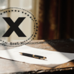 Letter lies abandoned on worn wooden desk with pen and warm glow from window