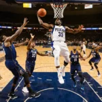 Zion Williamson leaps over Mavericks defenders with ball in hand and Pelicans erupt in celebration
