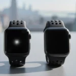 Apple Watch Series 11 and Series 10 displayed side‑by‑side on gray desk with subtle cityscape background.