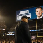 Daniel Jones looks over shoulder with John Harbaugh
