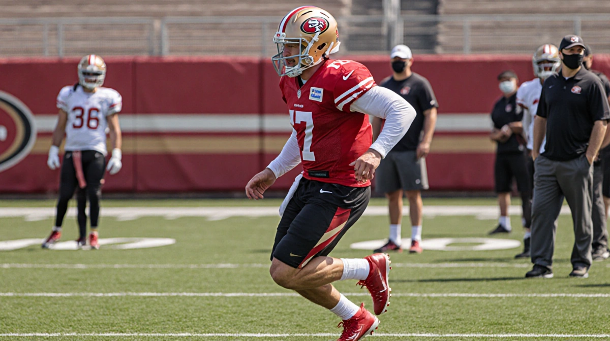Fred Warner running on field with 49ers teammates and coaches showing ankle recovery progress during practice