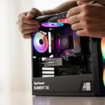 Hand unwrapping gaming desktop with RGB lights and Ryzen 7 CPU, excited expression on face