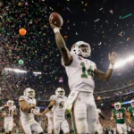 Keionte Scott runs for interception return touchdown with confetti and teammates celebrating