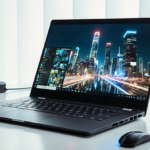 Lenovo Yoga 9i laptop displaying futuristic cityscape with natural light and sleek accessories