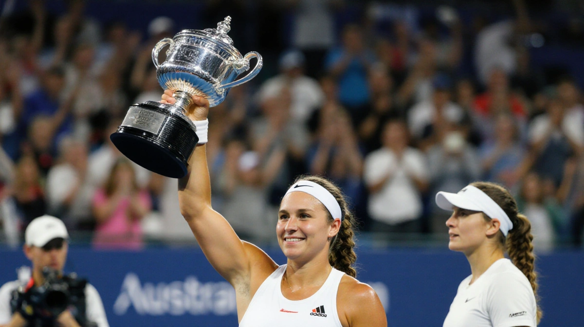 Madison Keys holds Grand Slam trophy high with Australian Open court and cheering crowd behind