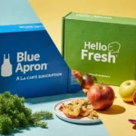 Table displays two meal kits side by side with fresh fruit and leafy greens showing eco‑friendly packaging.