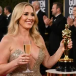 Nikki Glaser holding Golden Globe award with champagne glass and celebrities applauding behind her