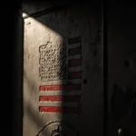 Weathered door opening with flag pattern and light leaking behind a blurred Minneapolis cityscape featuring a mosque