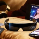 Futuristic smart glasses showing live stream on velvet pillow with OnlyFans cards and diamond headset nearby