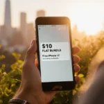Person holding a sleek smartphone with sunset cityscape and lush greenery around screen displaying a $10 bundle