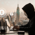 Person sits at laptop with hooded face and VPN router near desk and blurred cityscape behind warm lighting private and securi