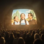 Dome screen glows with nostalgic colors over bustling night city and excited moviegoers.